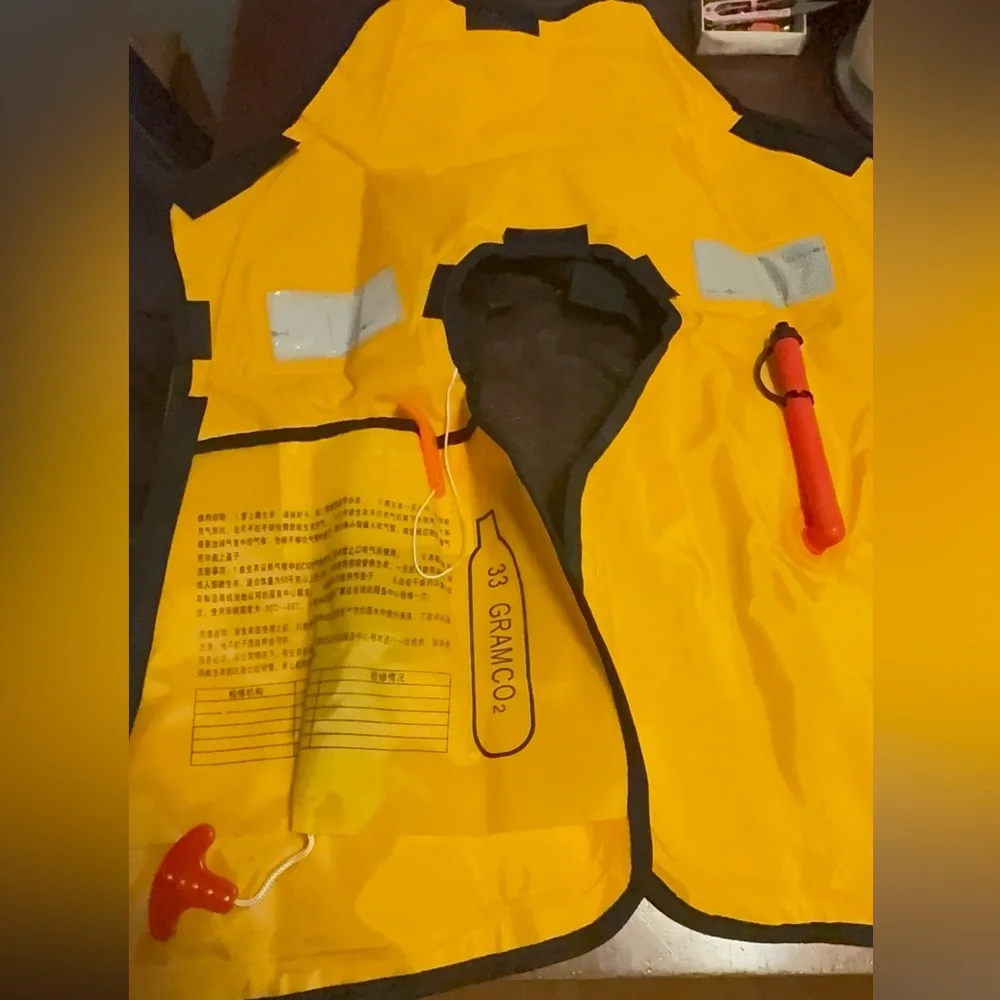 Water sports emergency self inflatable vest